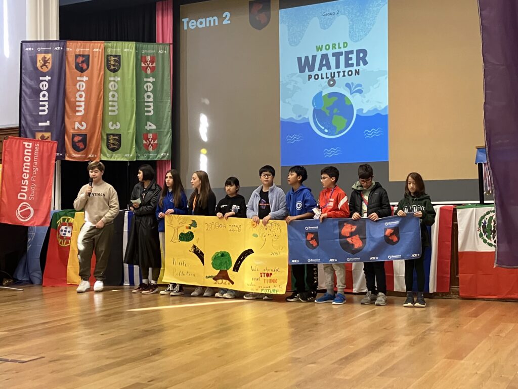 team 2 showing their work on world water pollution, and presenting it in the hall
