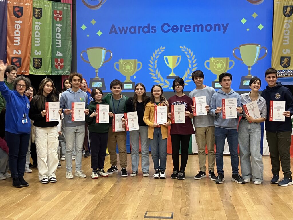 a picture of students holding their certificates at and award ceremony